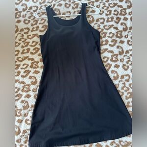 Black dress with attached interior cups. Size M. NWOT.
